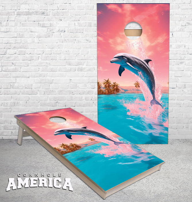 Dolphins jumping out of water pink sky and palm trees cornhole boards