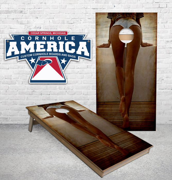 Girl looking at the Lake Cornhole Boards