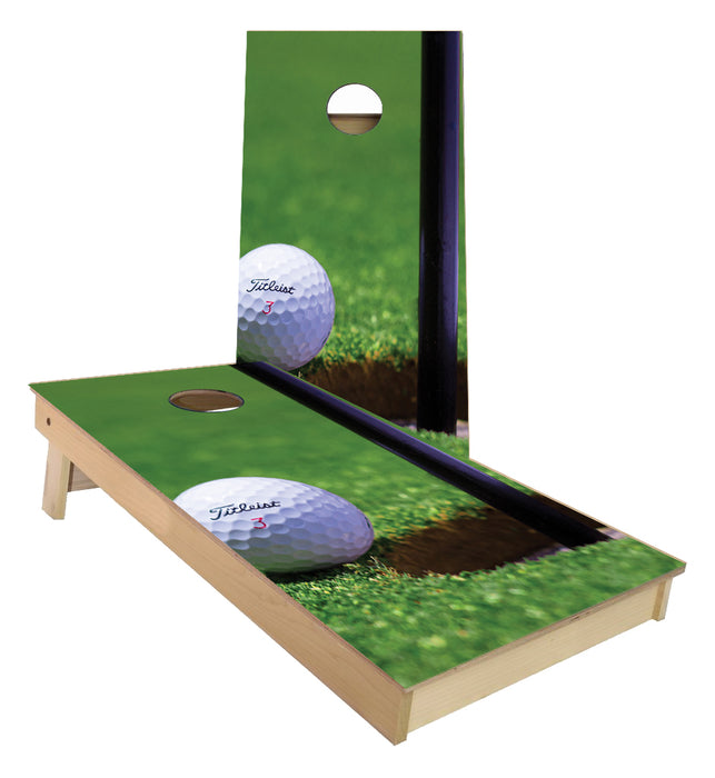 Golf Ball next to Flag Cornhole Boards