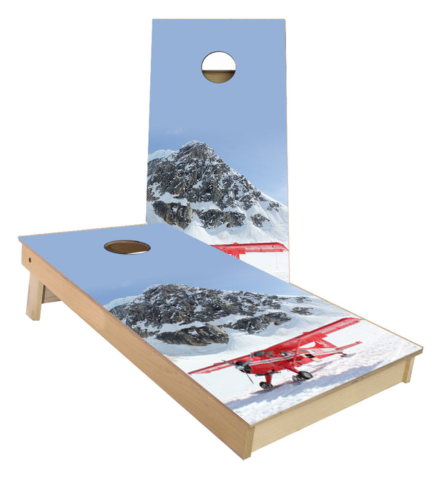 Airplane on the side of a mountain in the snow cornhole boards