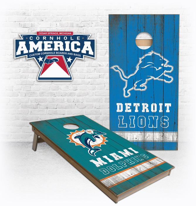 Lions and Dolphins striped on the bottom cornhole boards