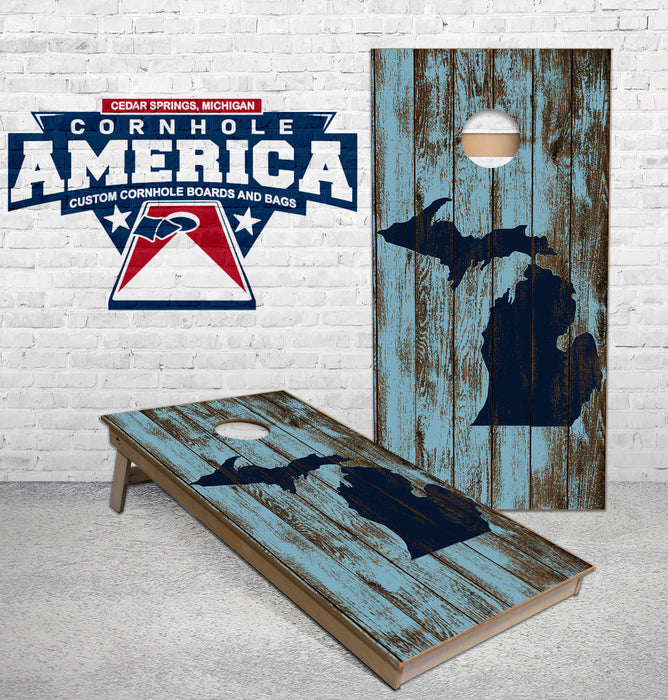 Michigan Map outline on rustic blue wood Cornhole boards