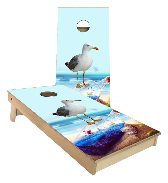 Sea Gull Standing on Glass bottle of Ocean View Sailboats cornhole boards